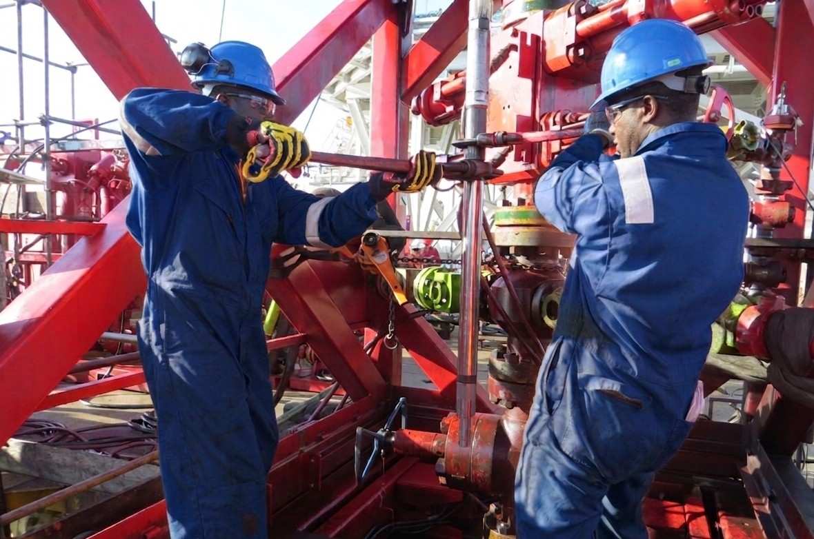 Nigerian oil and gas engineers at wellhead